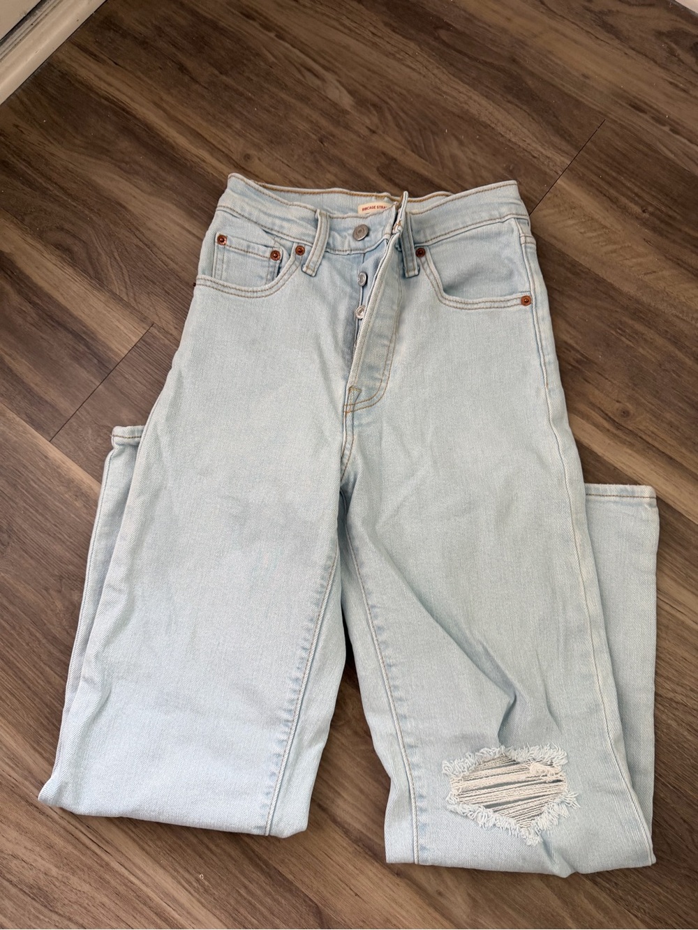 Levi’s Ribcage Straight Ankle High-Rise Light Blue Women’s Distressed Jeans